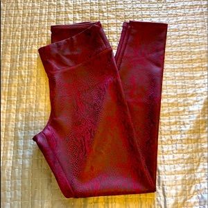 Express burgundy animal print leggings size Small